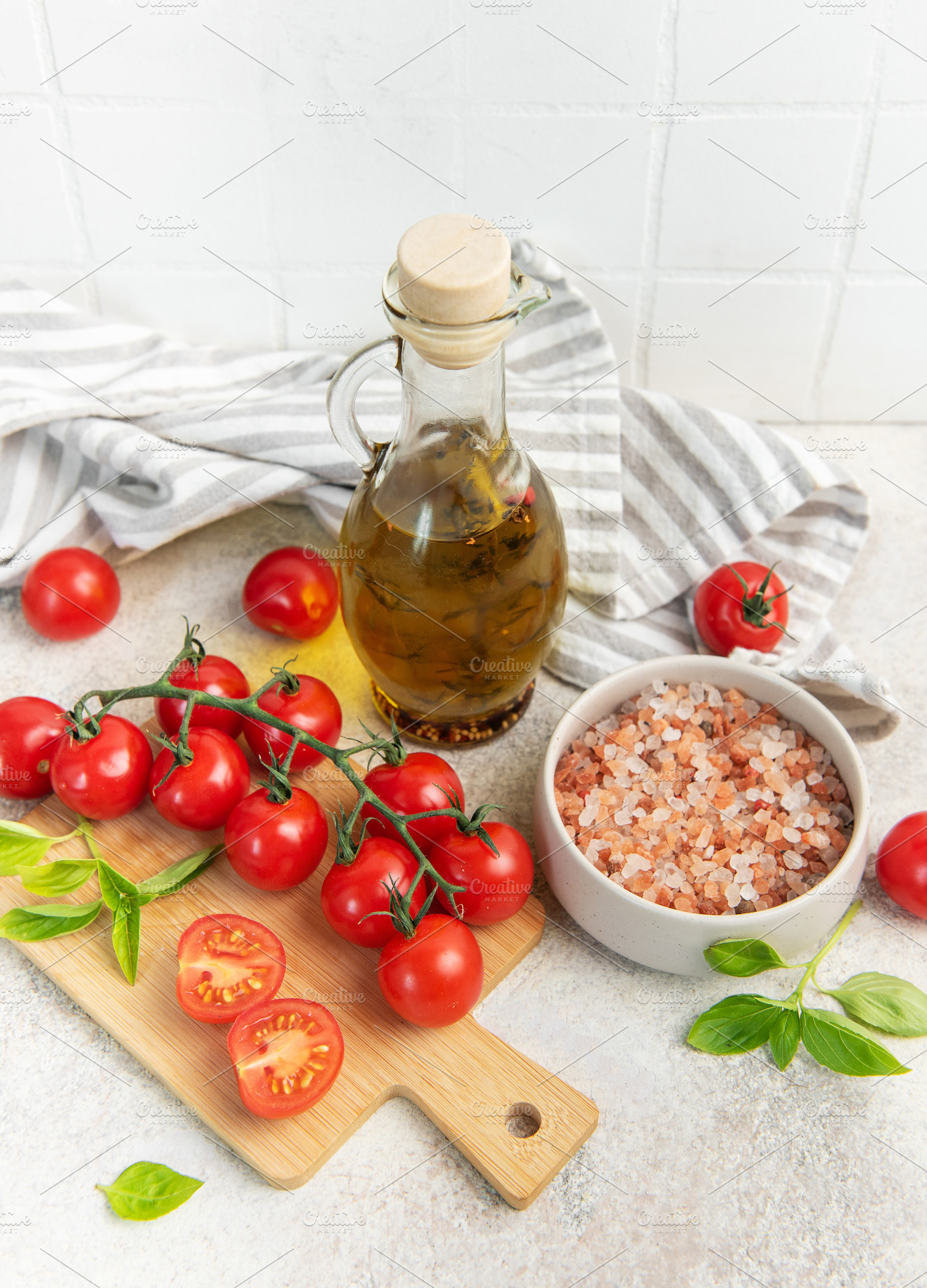 Fresh cherry tomatoes basil olive oil cooking ingredients, a Food & Drink Photo by Olena Rudo