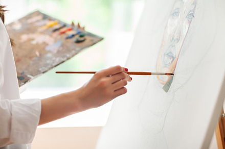 Hand of artist with brush painting, a Person Photo by Gladkov photography