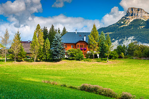 Beautiful alpine green fields, an Architecture Photo by Alpine Dreams