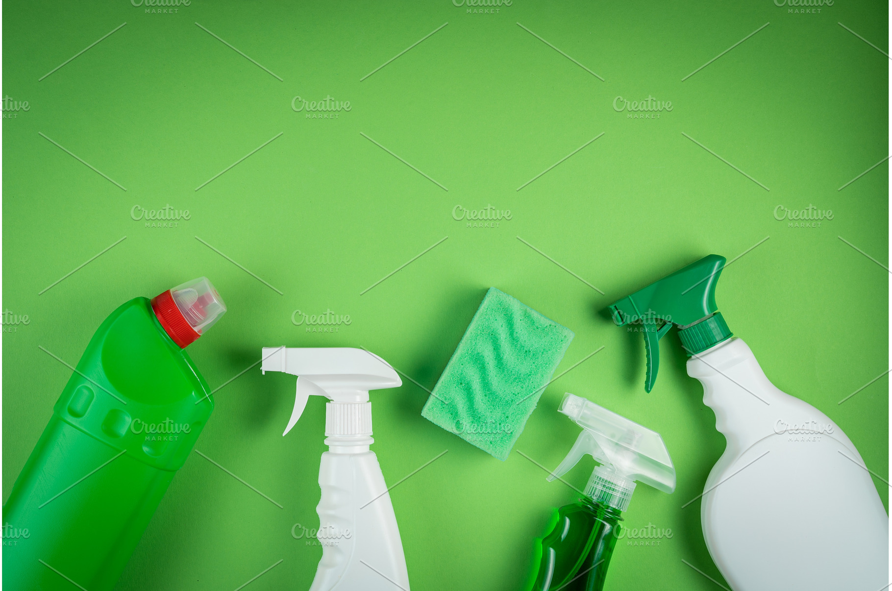 Cleaning supplies on green, a Business Photo by NaumenkoOS