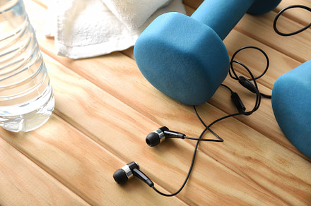 Music and sport concept with headphones and dumbbells on wooden, a Sports & Recreation Photo by Davizro's Market