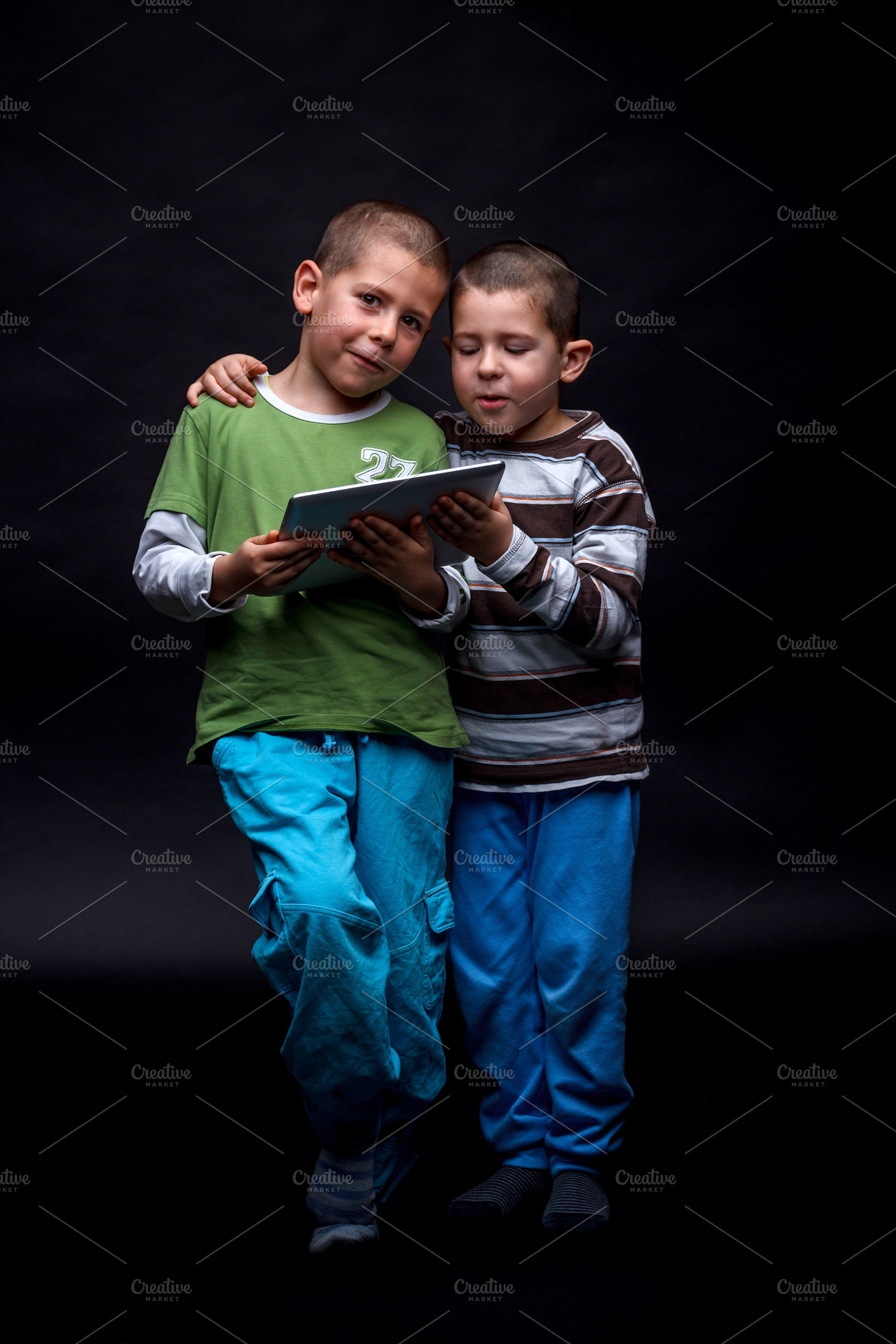 Boys using electronic tablet