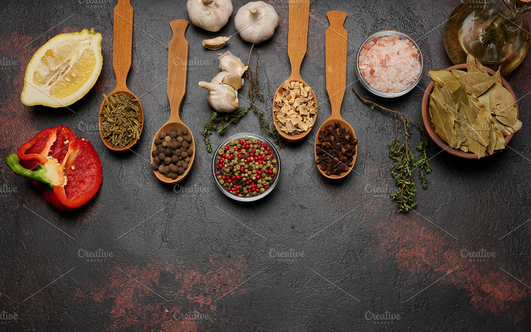 Spices on a dark background in wooden spoons: pepper, cloves, gi, a Food & Drink Photo by ndanko