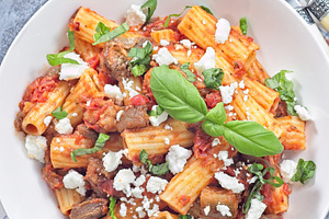 Rigatoni alla Norma pasta with eggplant, tomato, basil and ricotta salata, hori, a Food & Drink Photo by iuliia_n