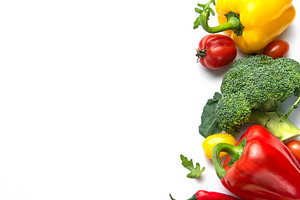 Fresh organic healthy vegetables forming colorful border on whit, a Food & Drink Photo by Olena Rudo