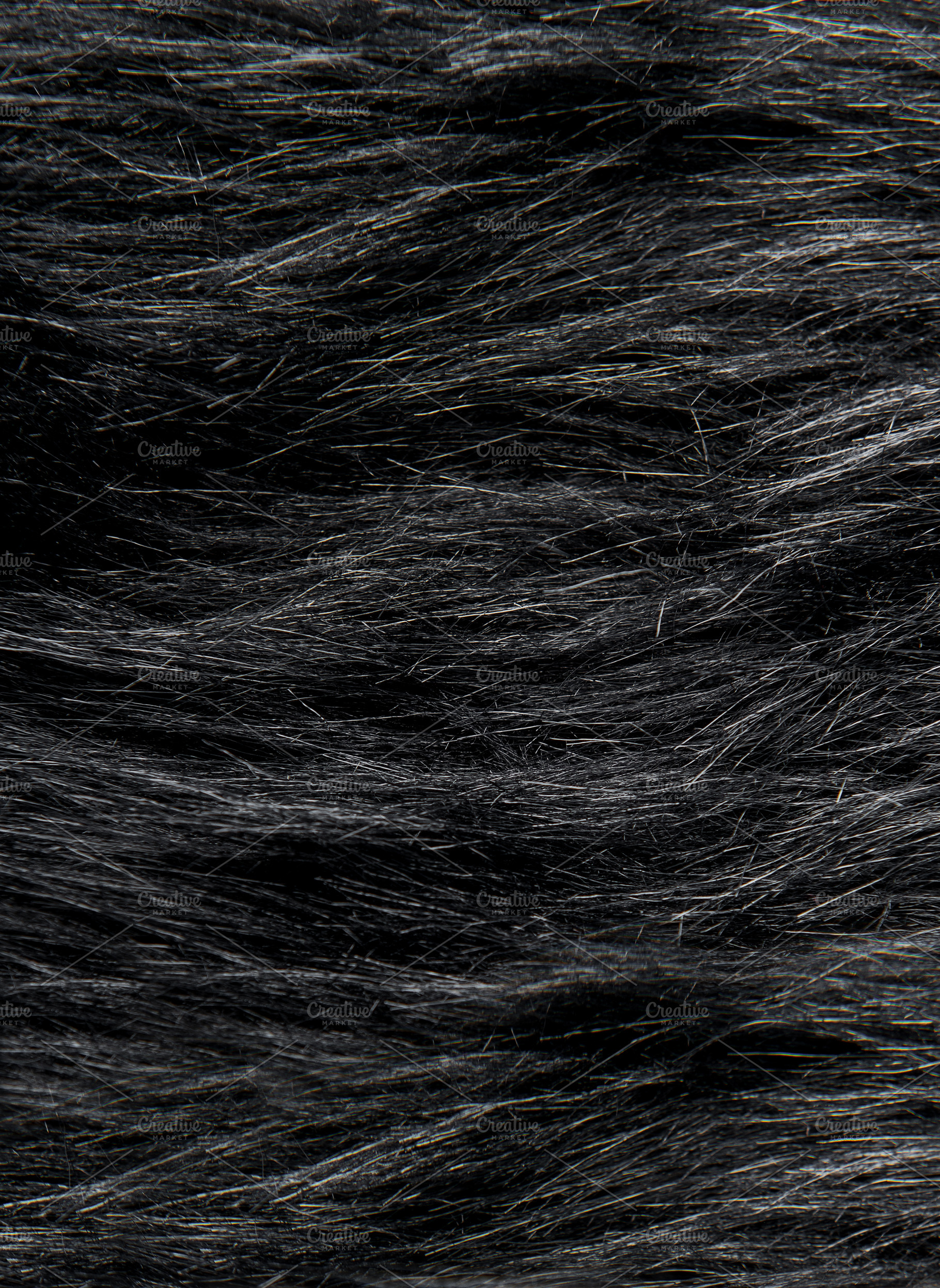 Dark animal fur surface showing soft hair fibers, a Background Photo by Olena Rudo