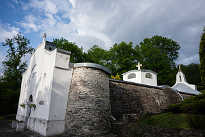 Small Catholic columbarium surrounded by nature on a cloudy day in Yazlovets, U, a Photo by AS photostudio