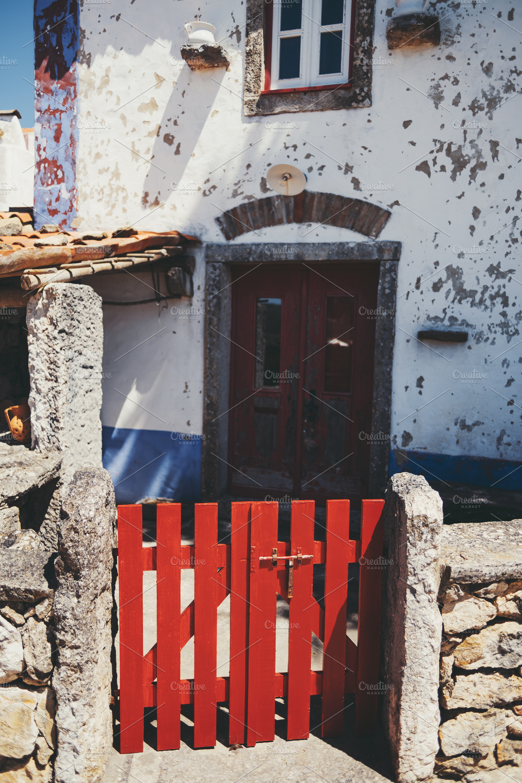 Red gate at rustic stone house, an Architecture Photo by SkyNext