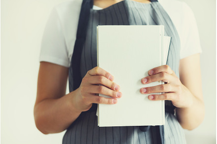 Young girl in white T-shirt reading