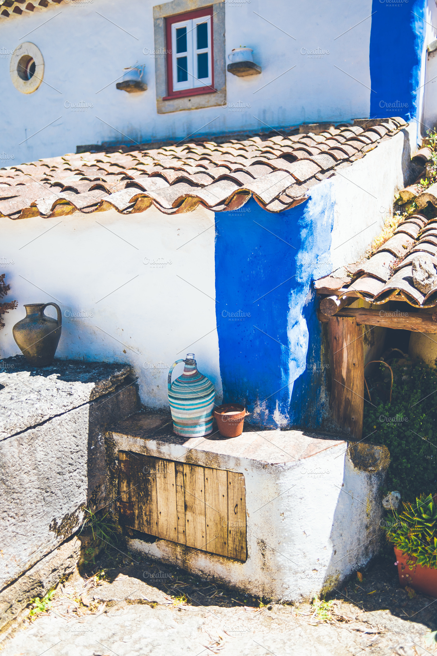 Rustic house wall with pottery, an Architecture Photo by SkyNext