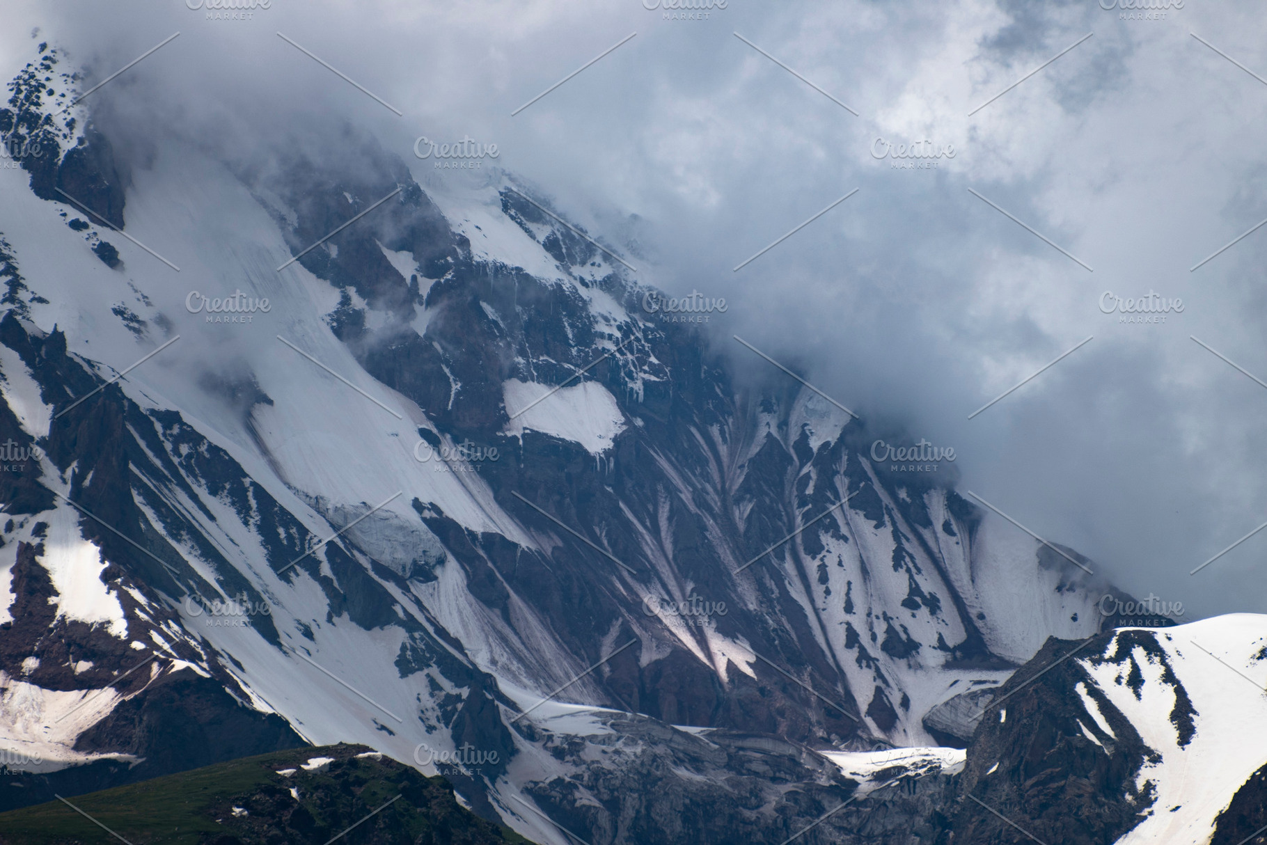 Snowy rocky mountain ridge shrouded in dense fog and clouds in G, a Photo by Pictures for you!!!!!!!!!