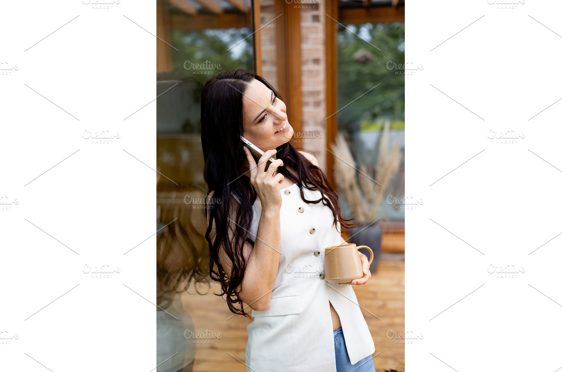 Smiling woman scrolling on, a Person Photo by HalfPoint