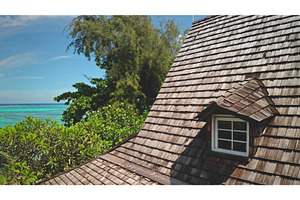 Wooden roof overlooking tropical, a Nature Photo by Goinyk