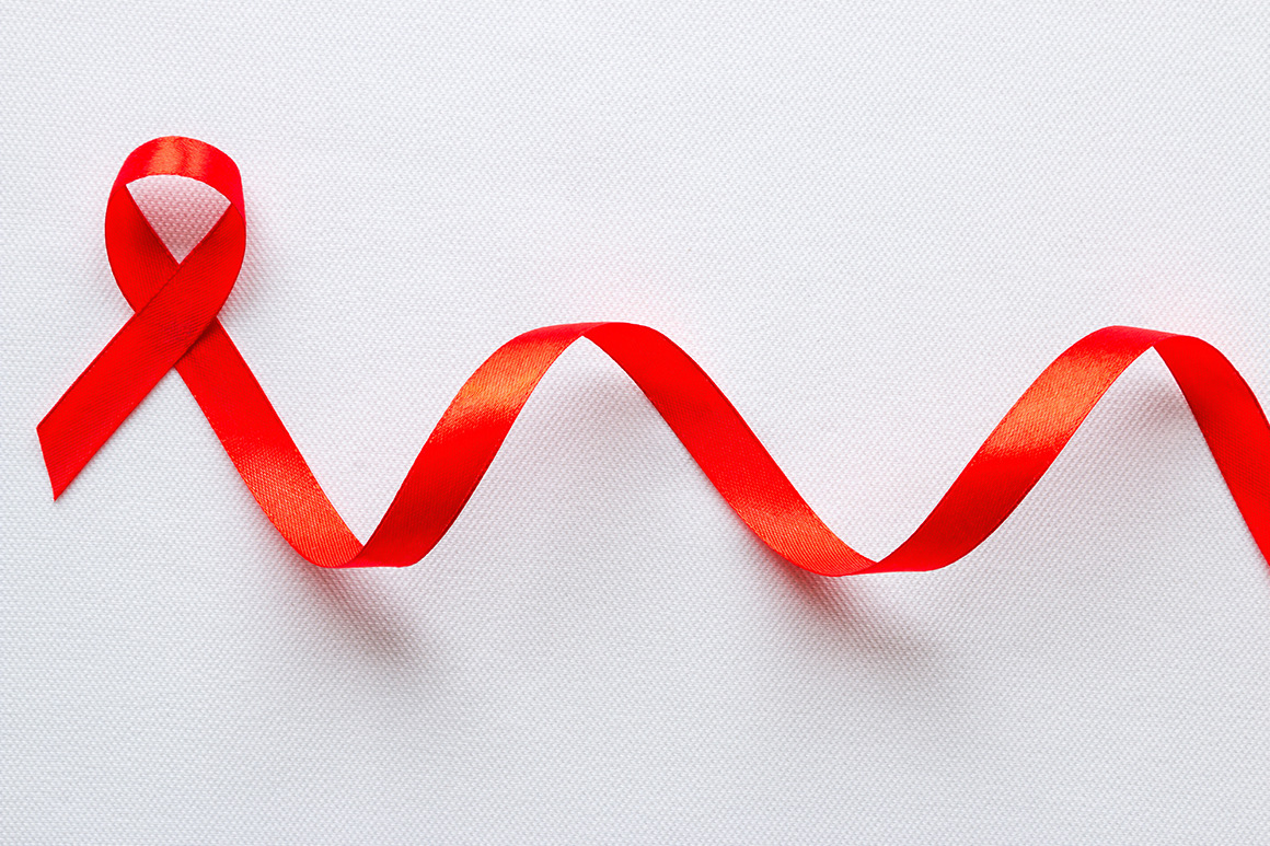 red ribbon symbol of World AIDS Day, a Health & Medical Photo by itakdalee