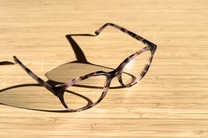 Eye Glasses On Wood With Copy Space