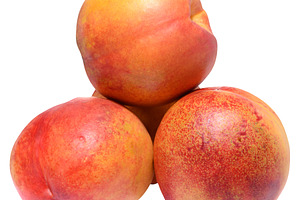 Pile of ripe peaches with smooth skin on isolated background, a Food & Drink Photo by ndanko