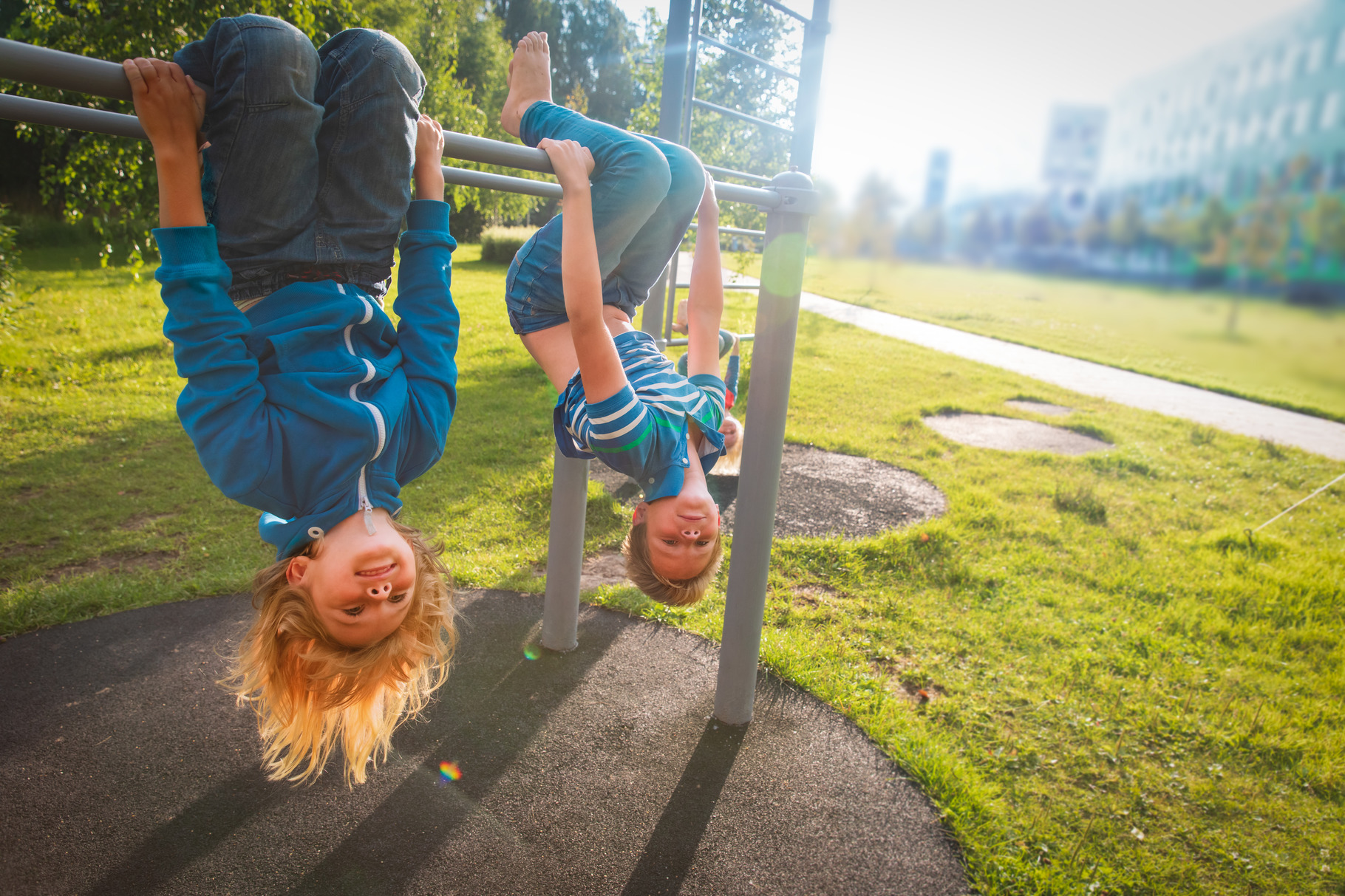 happy kids upside down on playground, a Person Photo by Nadezhda_Prokudina