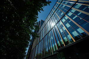 Modern glass building in Warsaw highlighting contemporary architectural design, a Photo by AS photostudio