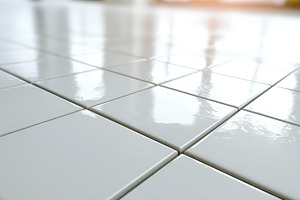 Shiny white tiled floor close-up, a Background Photo by AlyaAnd
