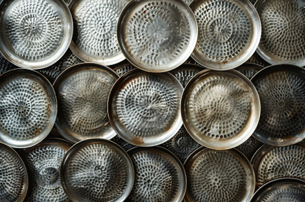 A collection of metal bowls stacked, a Photo by Iftikhar Alam