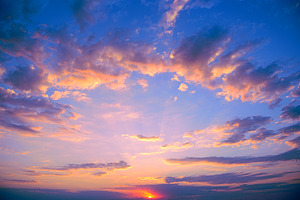 Fantastic pink sunset against bright blue sky