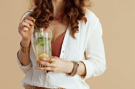 trendy woman in blouse and shorts isolated on beige, a Person Photo by Alliance Images