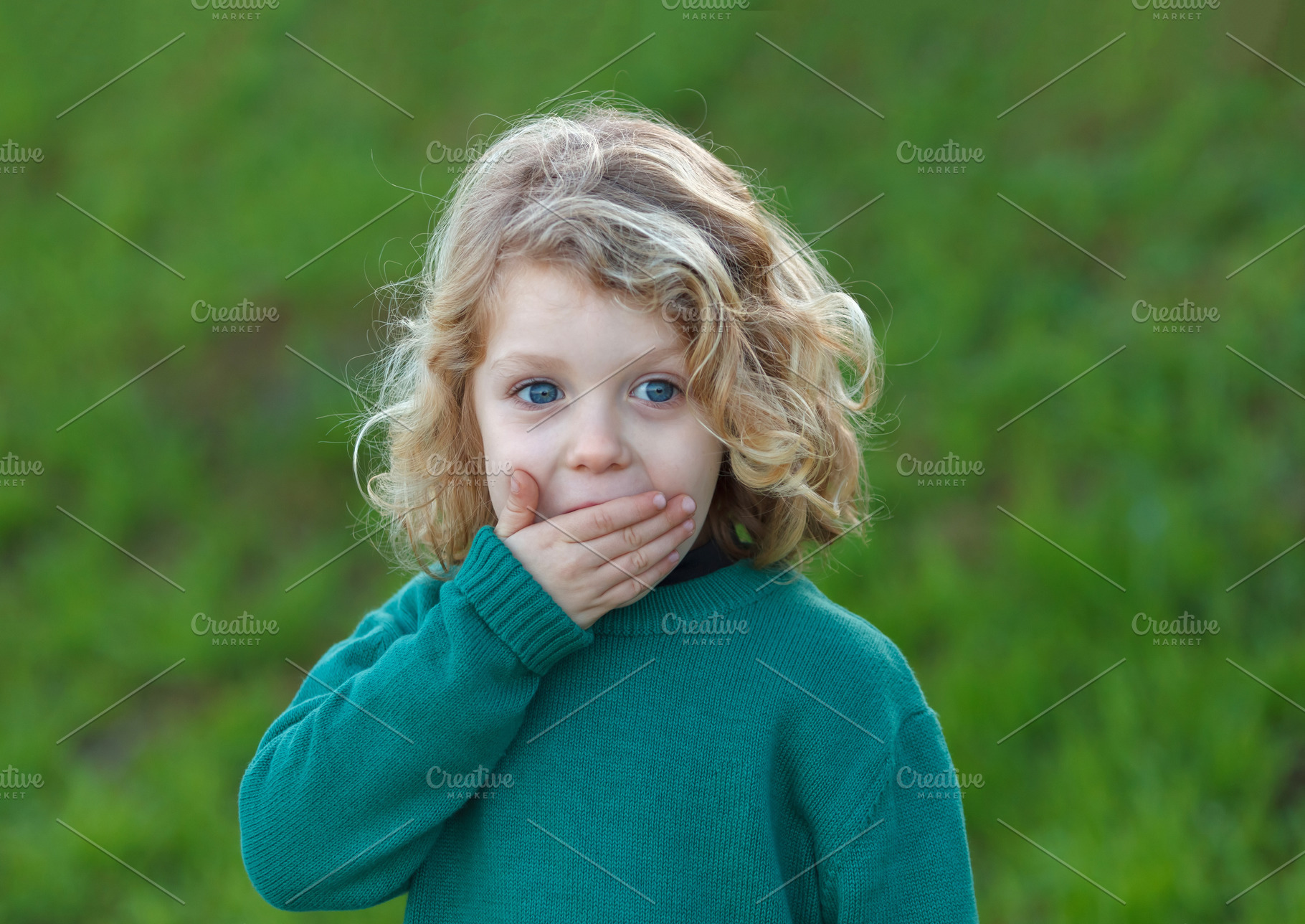 Surprised blond child covering his m stock photo containing child and cute, a School & Education Photo by José Manuel Gelpi