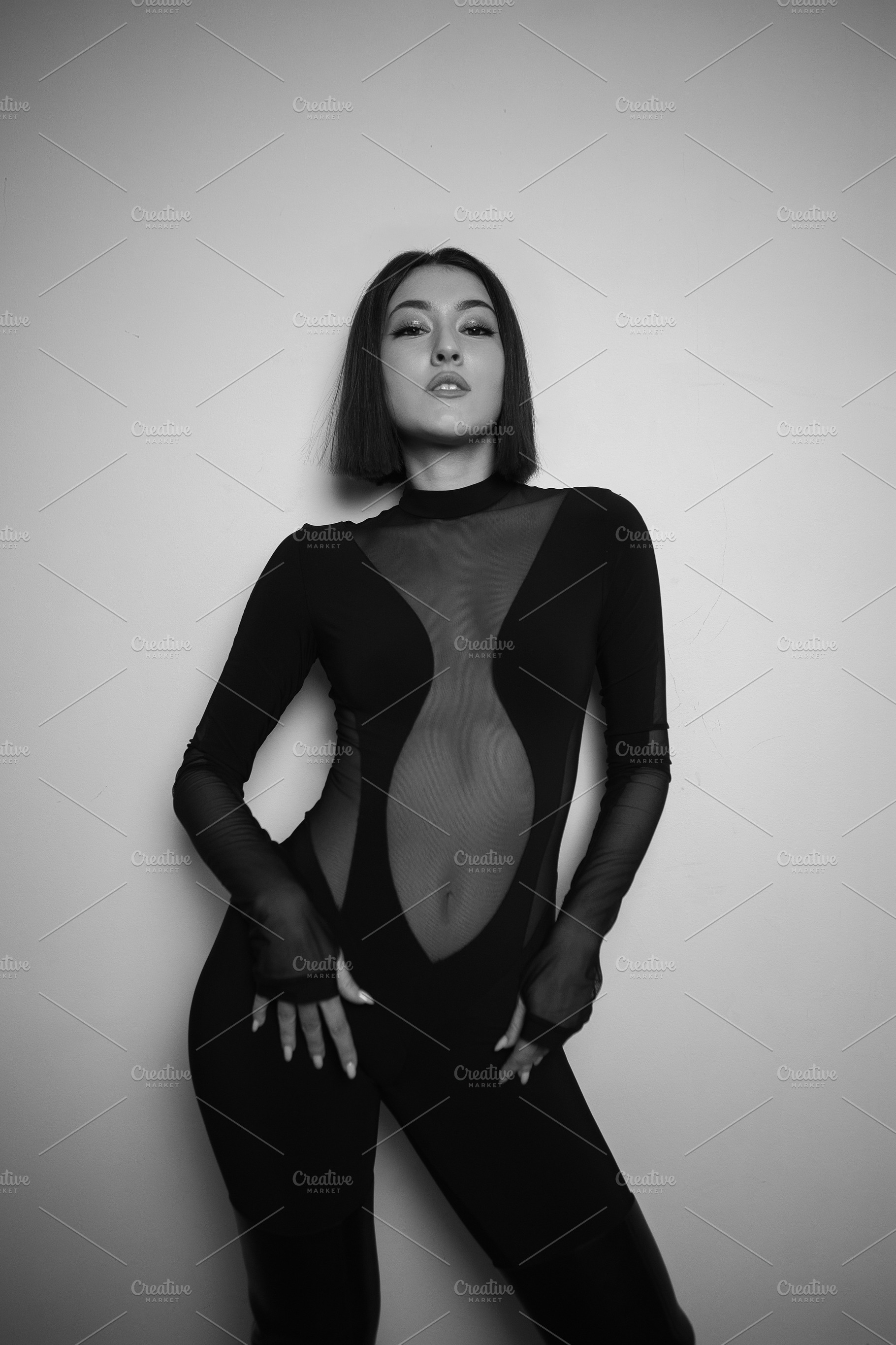 portrait of a young sexy woman in the studio on a white background in black boo, a Person Photo by SaulichPhoto