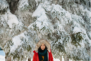 Woman enjoying winter time in snowy, a Person Photo by HalfPoint