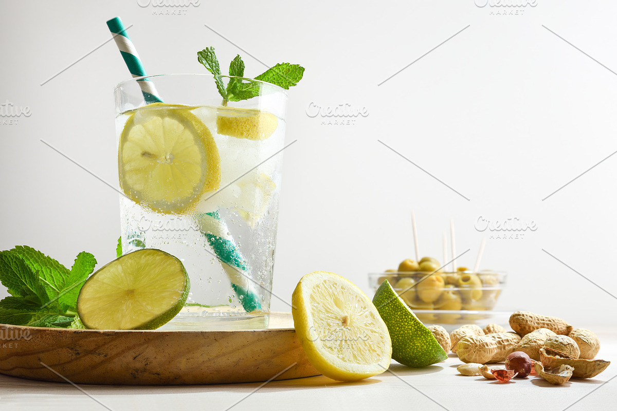 Refreshing carbonated lemon drink on table with white isolated b, a Food & Drink Photo by Davizro's Market (Photo 1 of 2)