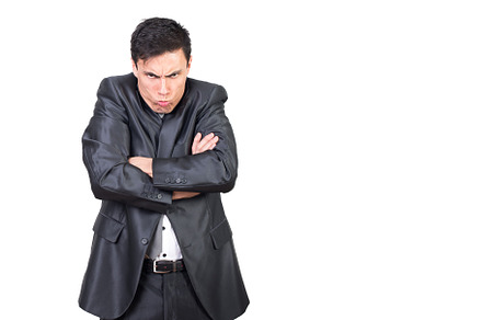 Childish angry man folding hands and shrugging shoulders, a Business Photo by Iván Moreno STOCK PHOTO