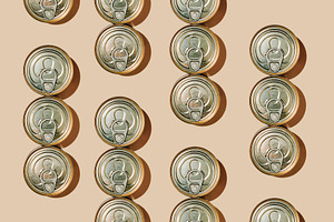 clusters of food cans on a beige background