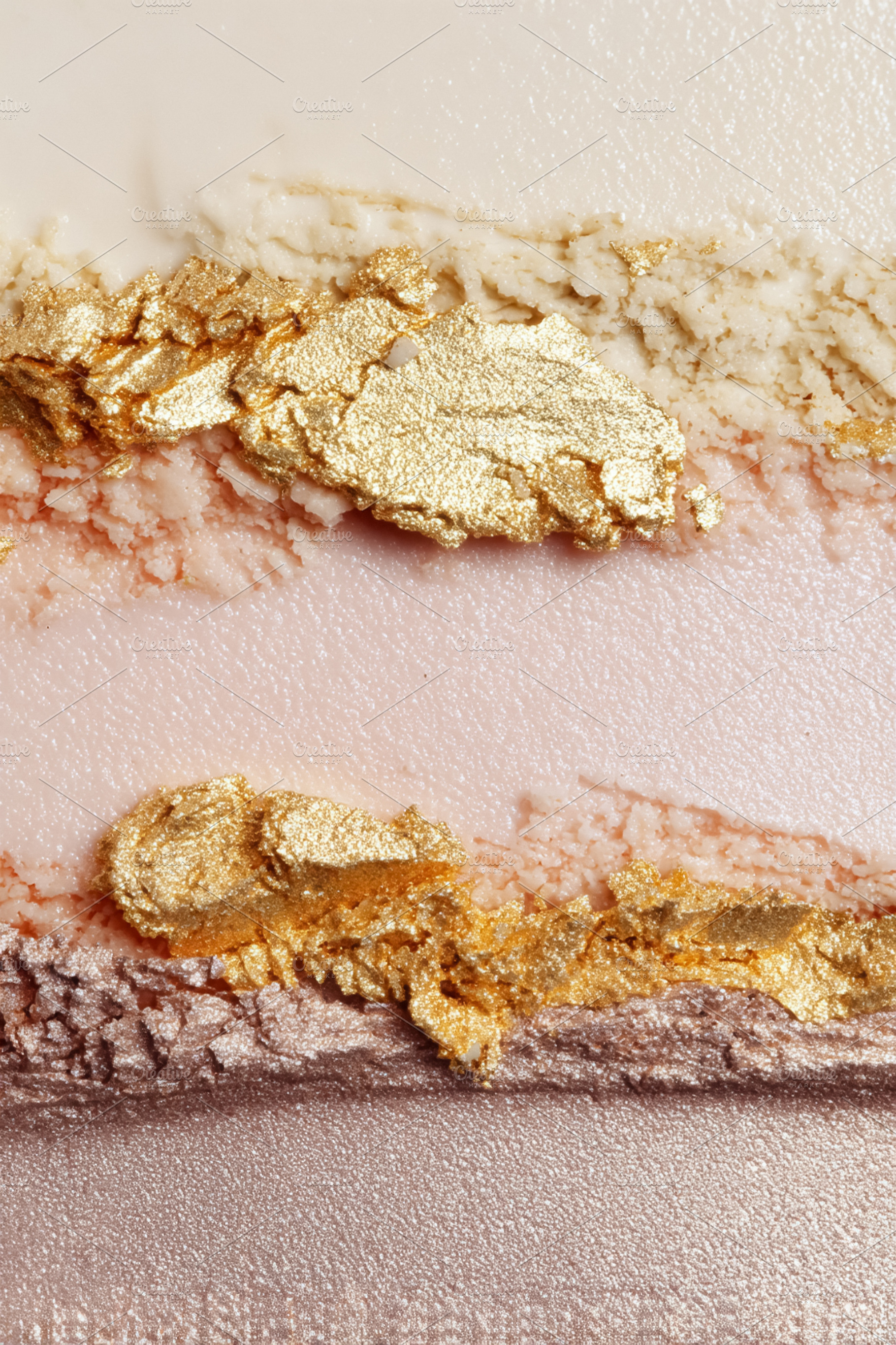 Eyeshadow cosmetic swatches with shimmering gold, pink, and neut, a Photo by Studio ANNA