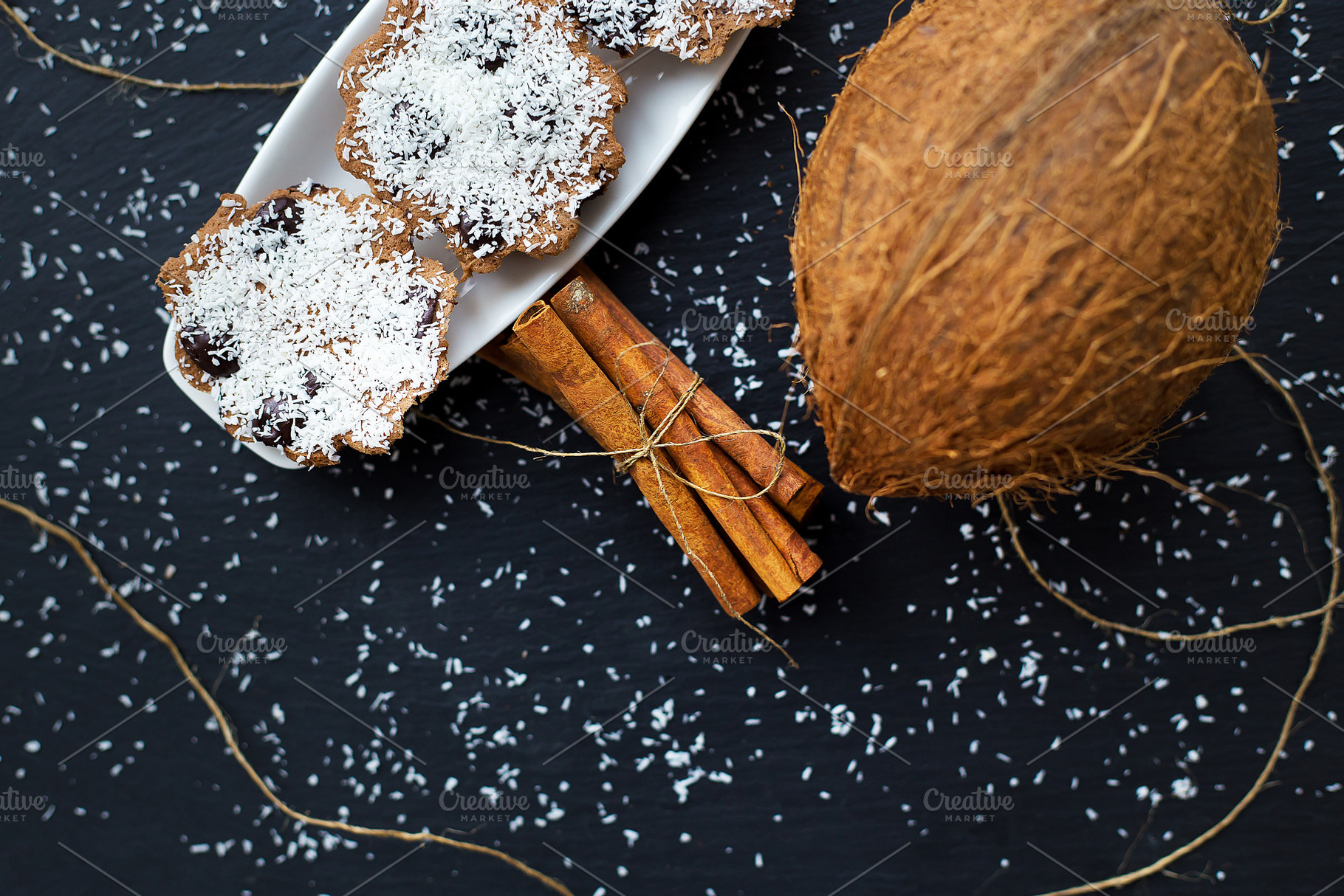 coconut muffins on a black background, a Food & Drink Photo by Artsaba Family
