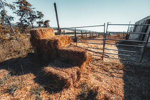 Hay Bales Beside Empty Farm Pen