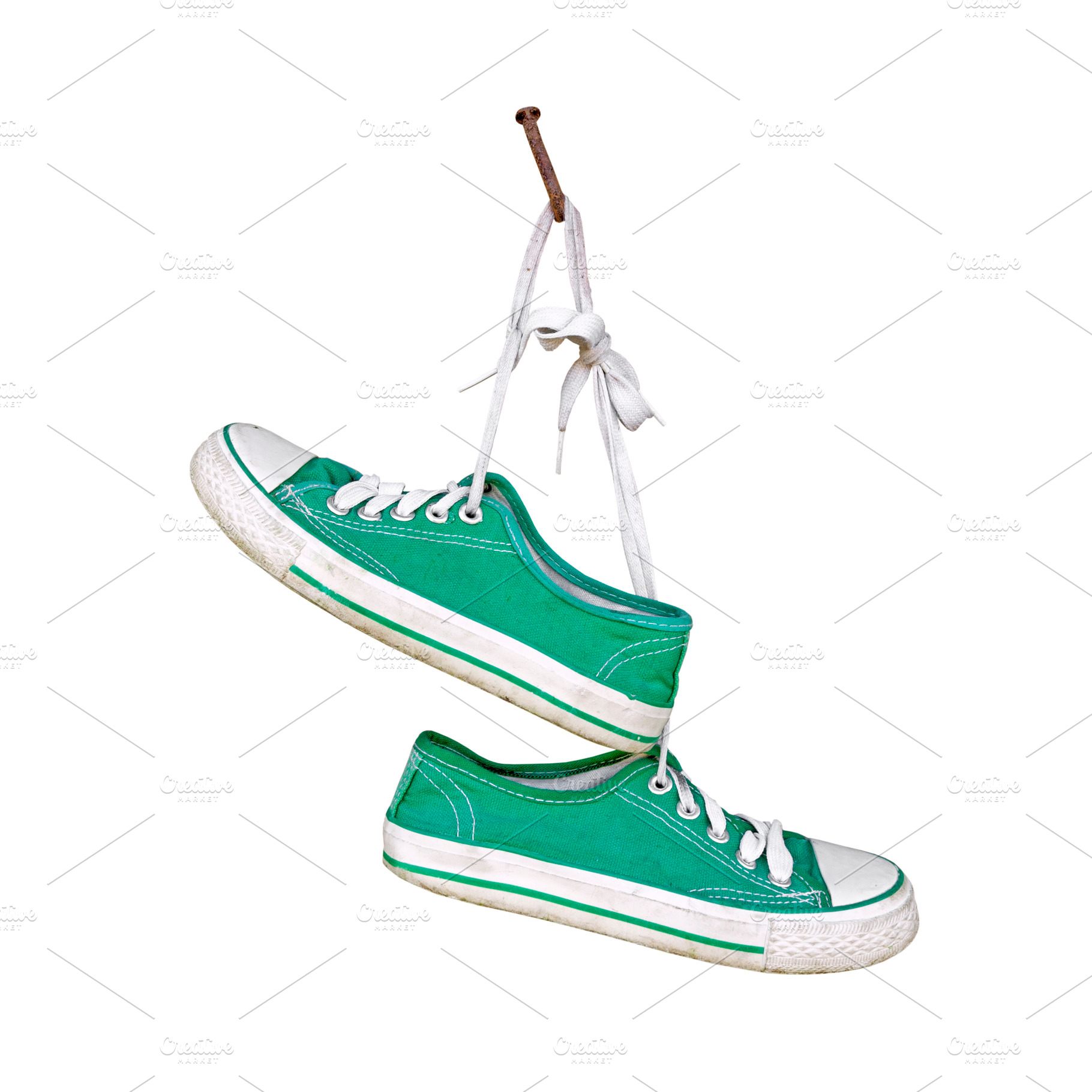 Old sneakers hanging isolated, a Sports & Recreation Photo by BOOCYS