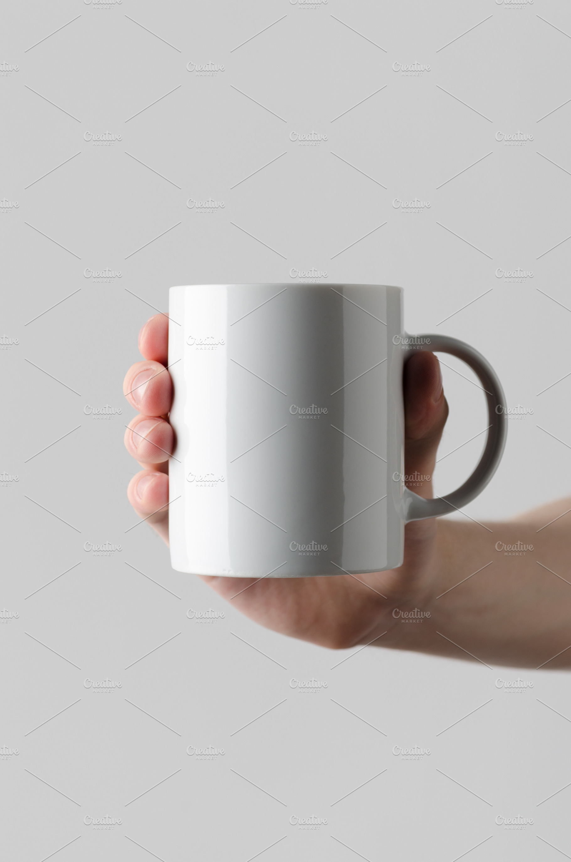 Mug mockup, hands holding JPEG, a Food & Drink Photo by Shablon
