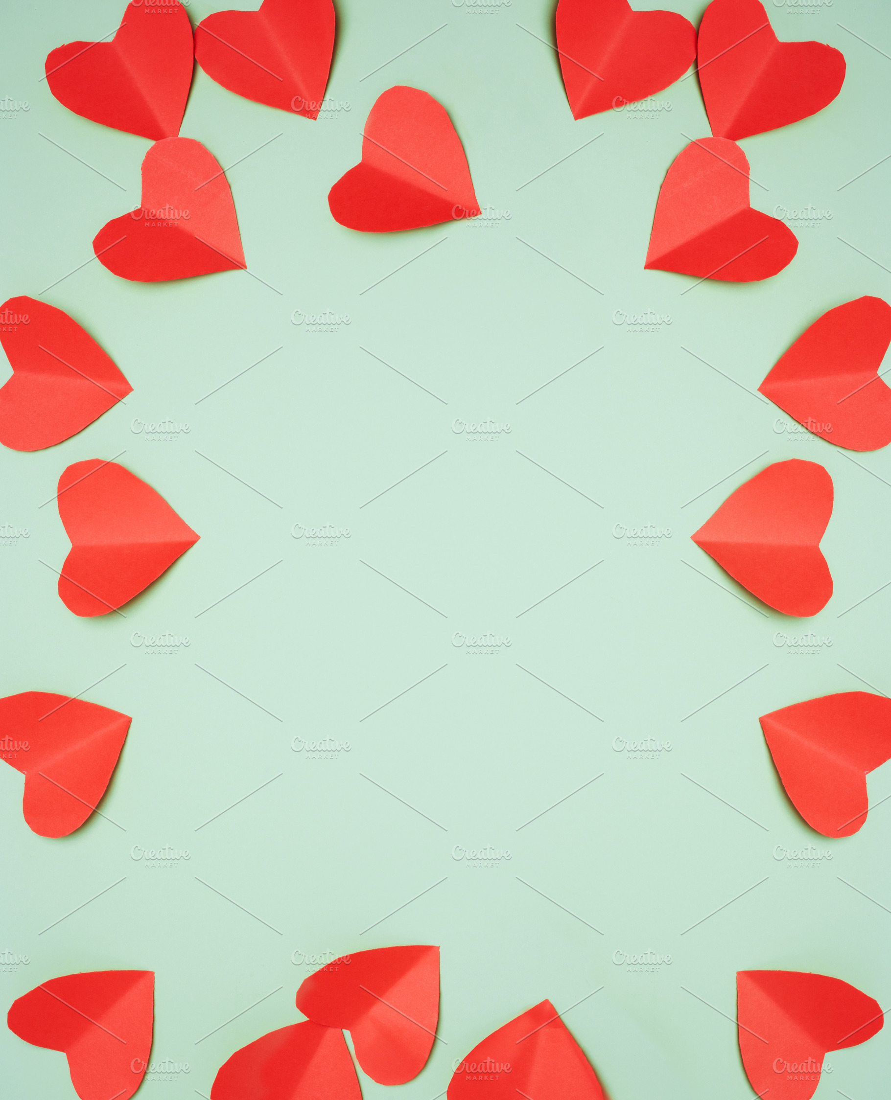 Red paper hearts arranged in a circle, with white space in the c, a Holiday Photo by ndanko