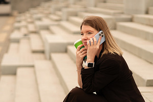 Young woman talking on phone, a Person Photo by Elena Vagengeim