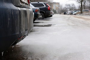 Row of parked cars on an icy, snow-covered street in winter, wit, a Transportation Photo by Ales Munt