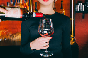 Red wine serving barman working hand alcohol glass, a Person Photo by Photo Drive Studio