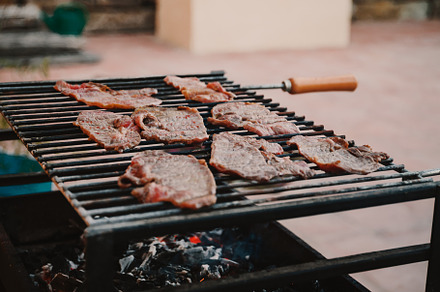 Fresh meat steaks on a grill, a Food & Drink Photo by Edalin's Store