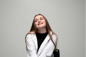 Young woman smiling while looking, a Person Photo by volodymyrshtun13795