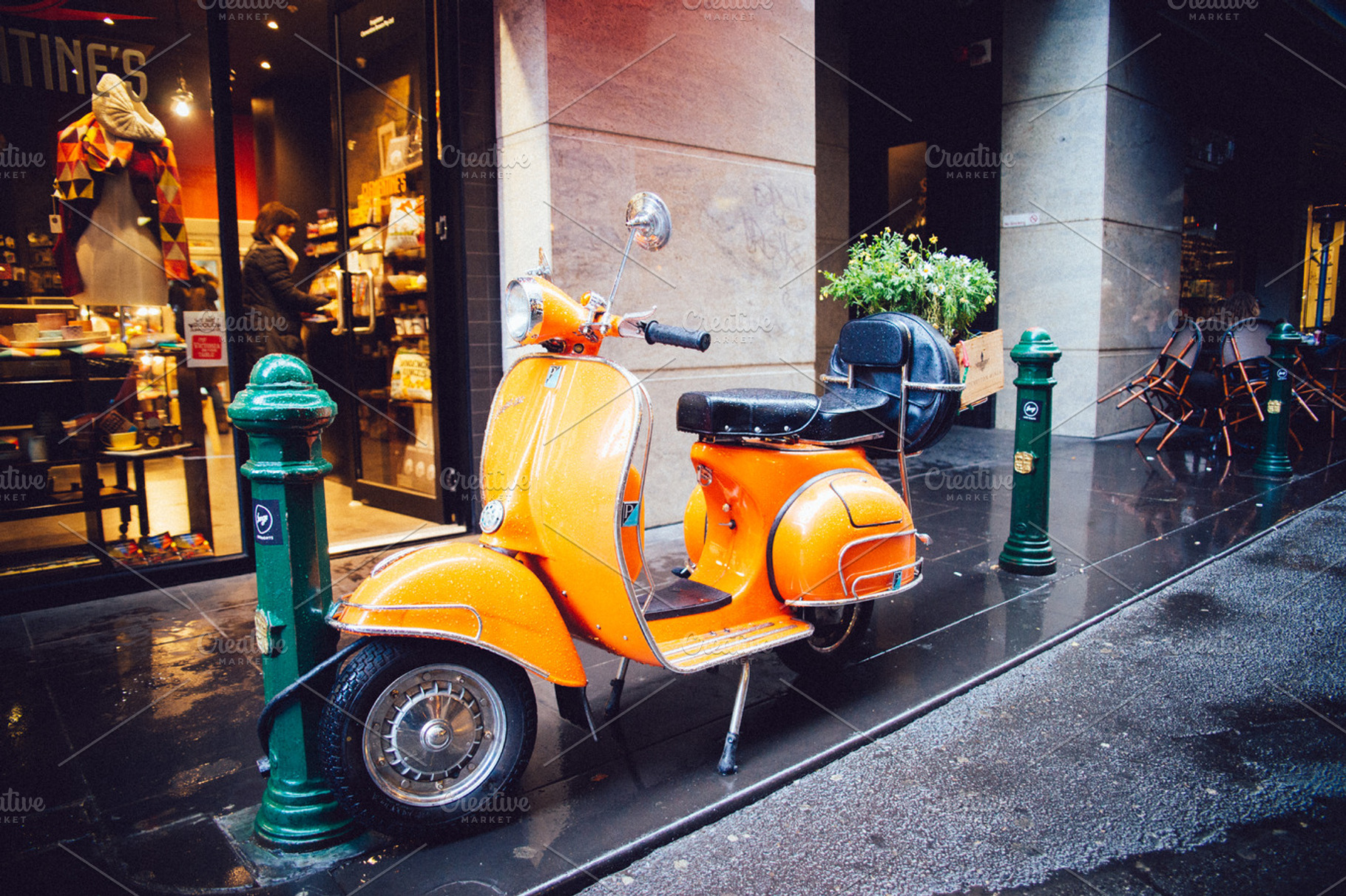 Orange Scooter Bike Parks On Street