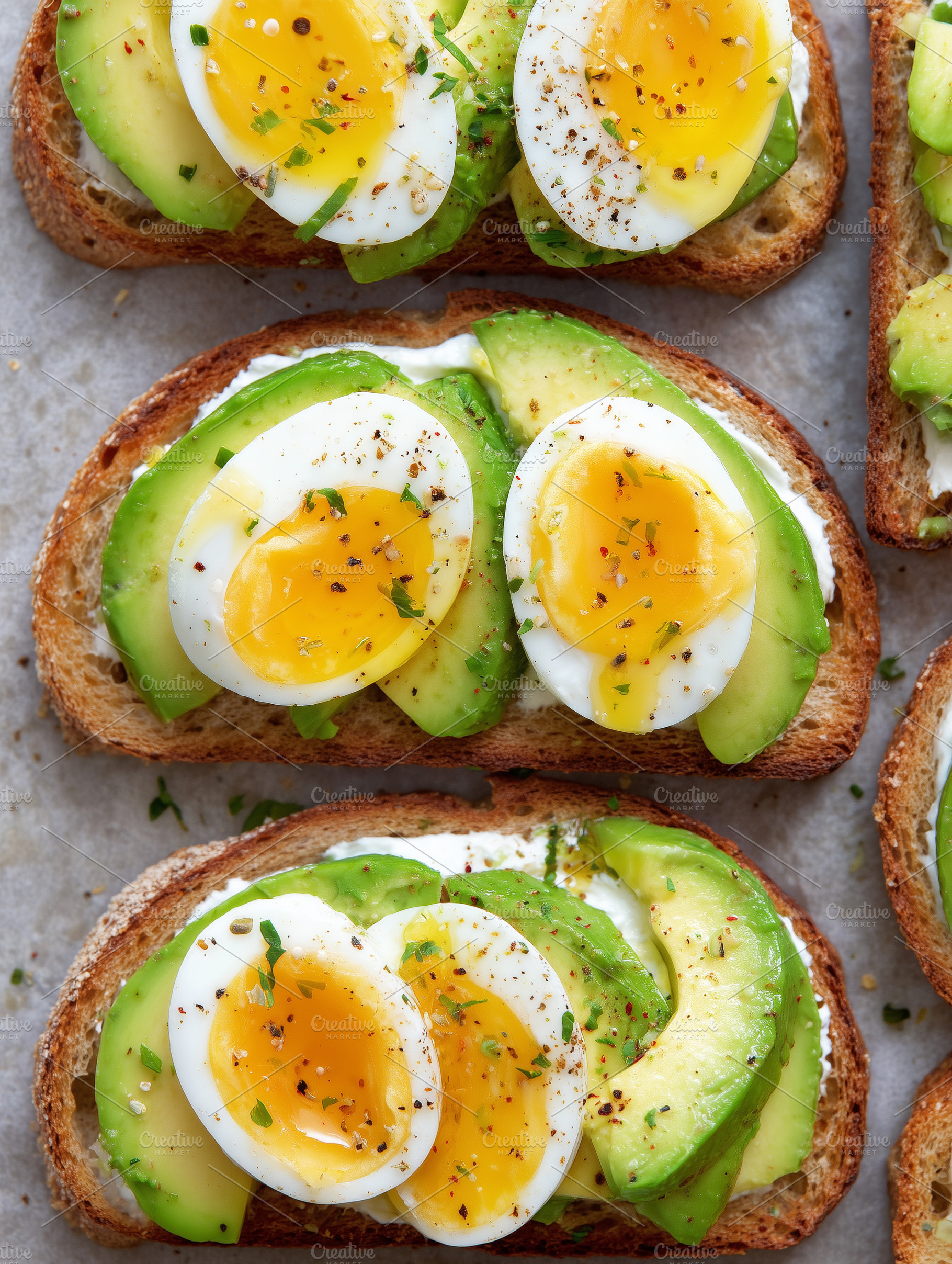 Top view of avocado toast with eggs, a Food & Drink Photo by MistyDay