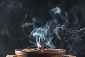 Various incenses on black background containing abstract, aroma, and