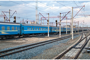 Passanger train passing the station, a Transportation Photo by Leonid Andronov