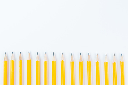 Yellow school pencils containing back to school, copy space, and white, a School & Education Photo by Siân C Photography