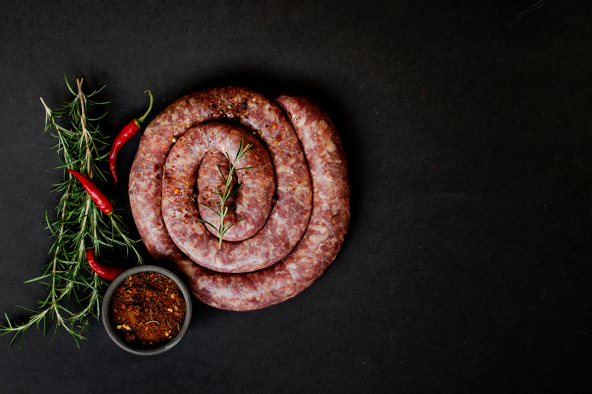 Raw beef sausages on a castiron pan  selective focus containing heap, a Food & Drink Photo by Wild Drago Shop (Photo 1 of 2)