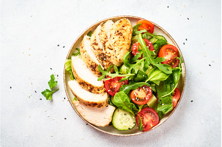 Green salad with grilled chicken, a Food & Drink Photo by Nadia-nb